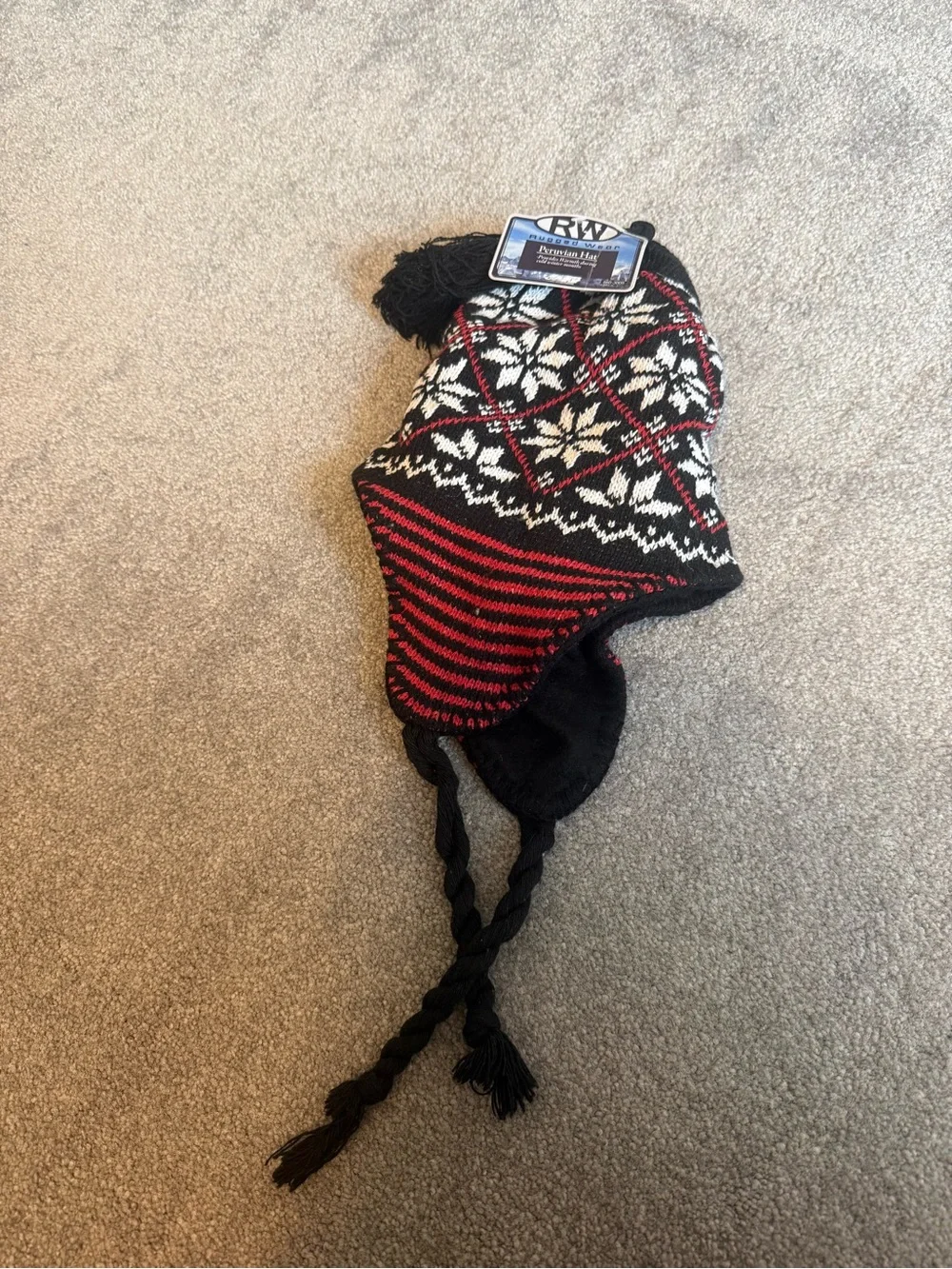 Kids Black, White & Red Knit Earflap Hat with Tassels snowflake and red detailin